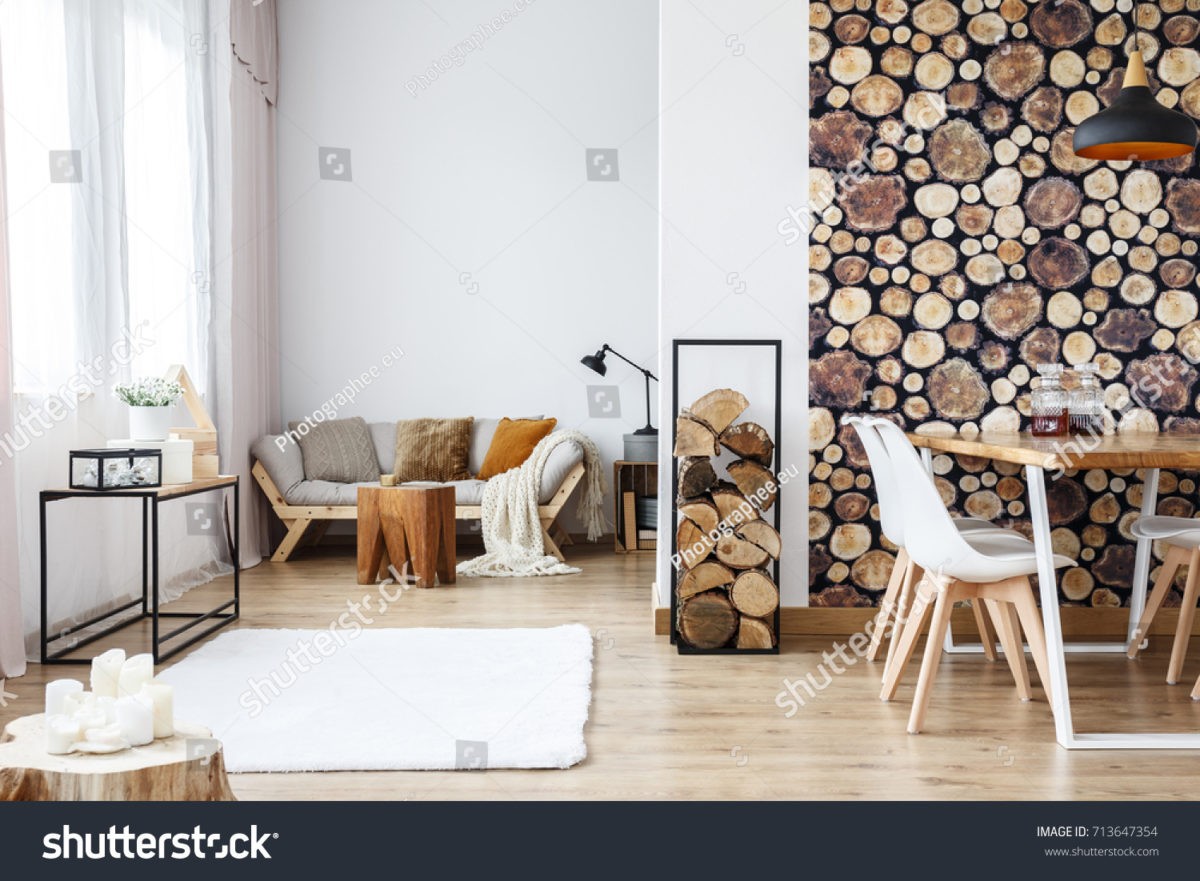 stock-photo-wooden-log-texture-wallpaper-in-cozy-dining-space-of-white-open-plan-apartment-with-sofa-rug-and-713647354.jpg